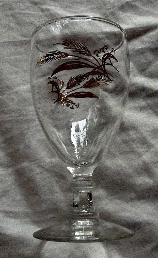 The water goblet, 5-7/8" tall in the Prairie Wheat Lifetime gold Golden accent crystal glasses stemware made by Homer Laughlin