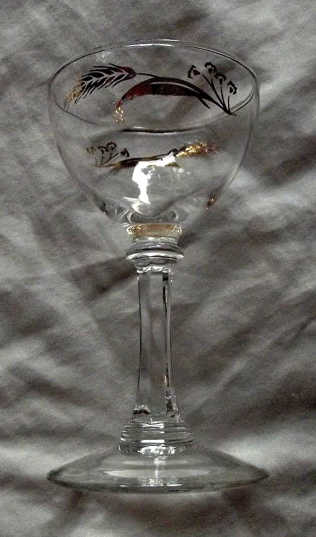 The sherbet cups, 4-7/8" tall by 3.75" ... in the Prairie Wheat Lifetime gold Golden accent crystal glasses stemware made by Homer Laughlin