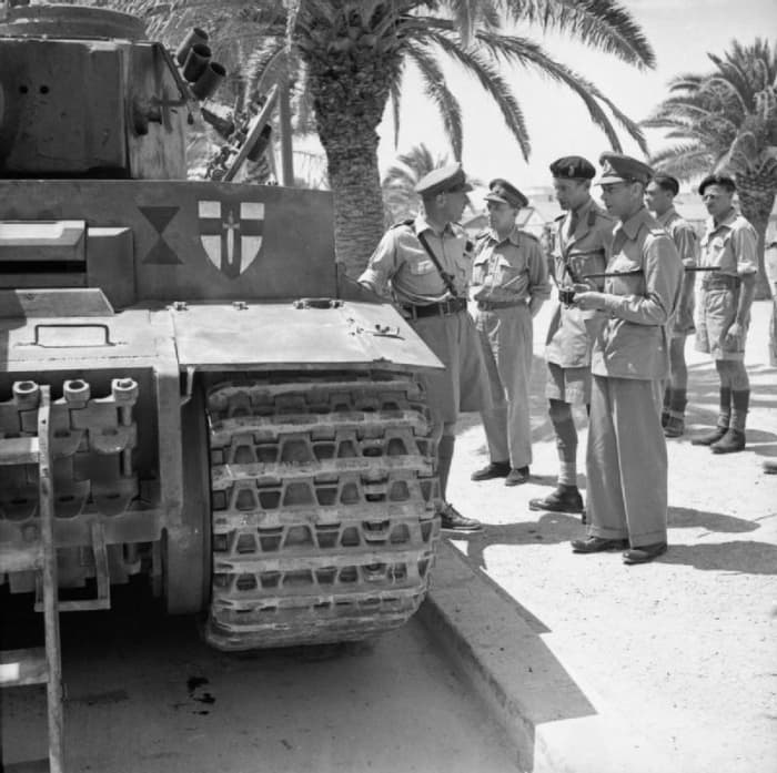 Photo by Sgt Gunn, shows The British Army in Tunisia, 1943. Here, King George VI inspected the captured Tiger Tank 131.
