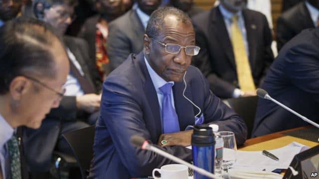 President of Guinea Alpha Conde, center, listens as the heads of the United Nations, the International Monetary Fund and the World Bank discuss the Ebola outbreak at the World Bank in Washington, Oct. 9, 2014.