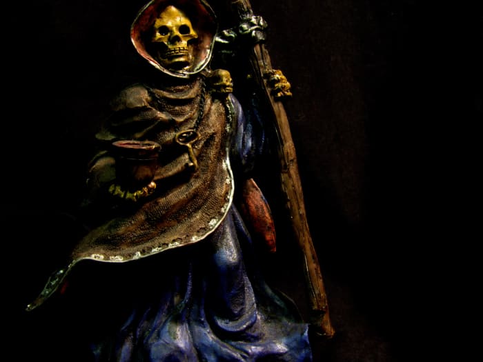 I grew up celebrating Halloween and had this statue, which is now hers for a while. Dollar stores and drug stores yield much inexpensive bounty this time of year, especially if you shop sales. Altar décor need not leave you penniless.