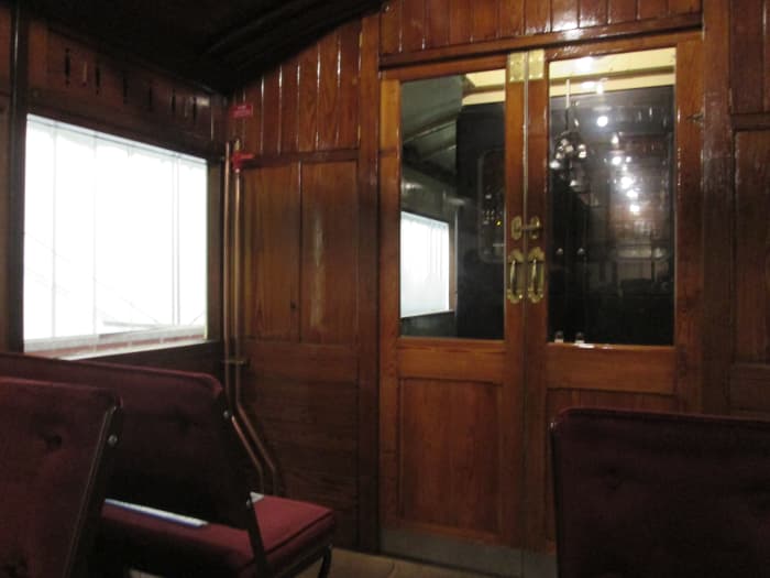 At the other end of the passenger saloon area, the door to the motor compartment and beyond that the second driving compartment