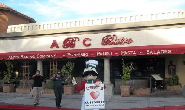 Mr Scrib's a nearby pizzeria pokes fun at Amy's Baking Company by sending their mascot to troll the company.