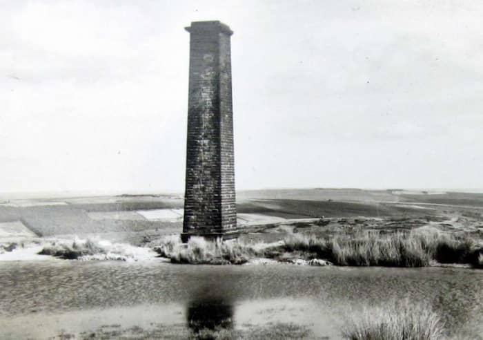 Rosedale Chimney, ventilation duct for underground workings at Rosedale West. This was where Rosedale Village to Hutton-le-Hole road passed, having climbed a steep, winding bank (up to halfway 1:4, and 1:3 towards the crest).