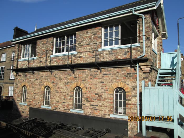 Seen from the front, the signal cabin walkway at window level to keep the glass clean (essential for safety's sake) and stairway painted light blue in the manner of British Railways' North Eastern Region
