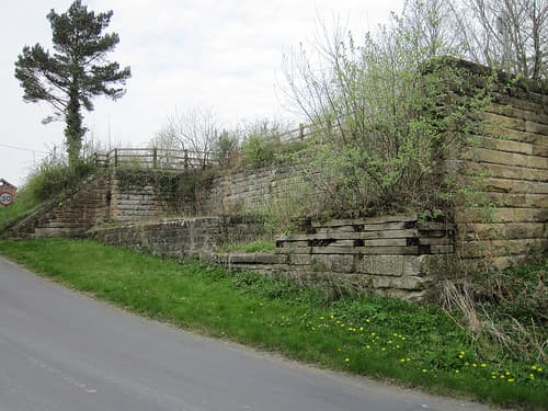 Beside the road that slopes down to the River Esk, the coal cells have lost their dividing walls. Horse-drawn carts would originally have stood here to bag and load coal, latterly motor lorries until 1965.