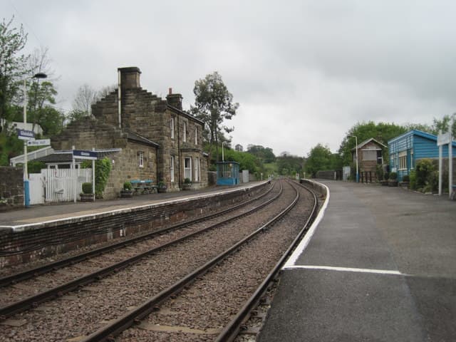 Glaisdale Station looking west, with the Station Master's house, offices and facilities on the 'Up' platform. A waiting shelter in the earlier NER building style stands midway on the 'Down' platform near the former signal cabin