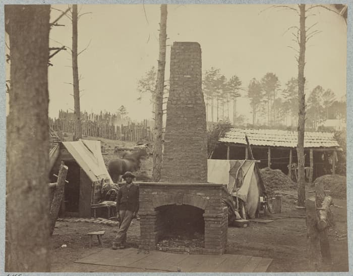 Notice the elaborate fireplace that the soldiers built. The camp is being cleared away and it is left standing alone. This was for a general. Brandy Station