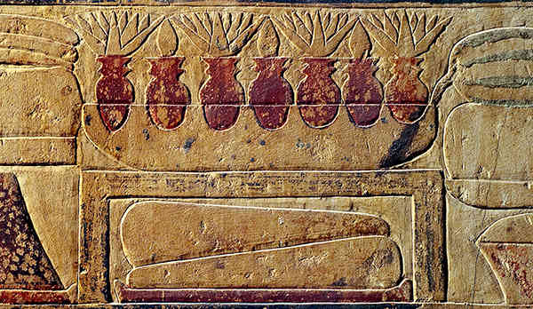 Seven lotus vases nesting in a shallow bowl on a table. Tomb of Niankhkhnum and Khnumhpotep. Oxford Expedition to Egypt.