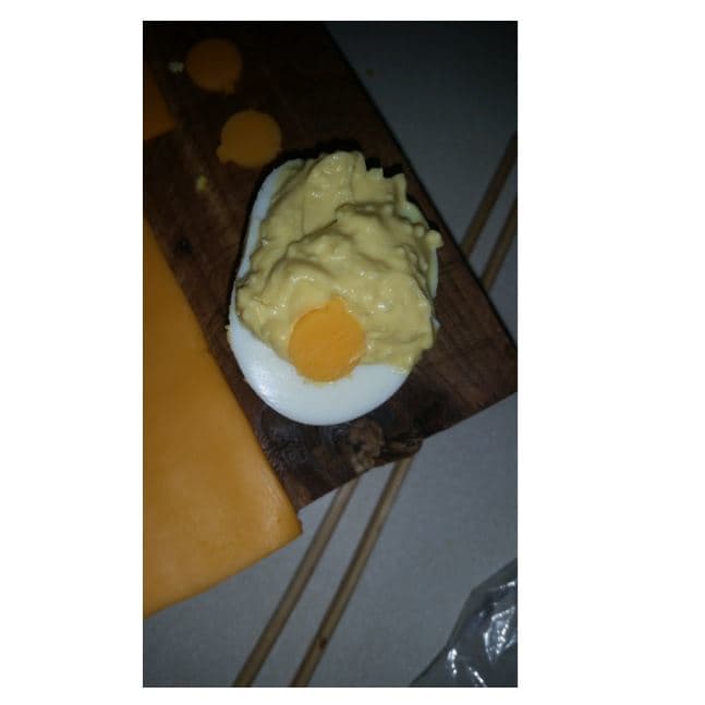 Swaddled baby deviled egg. Used the end of my orange juice tool from Pampered Chef or Tupperware to cut the circles with the nose...