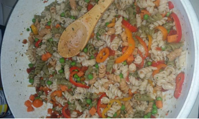 Suddenly Salad Classic with diced tomatoes and sliced sweet peppers, frozen peas and cubed carrots added.