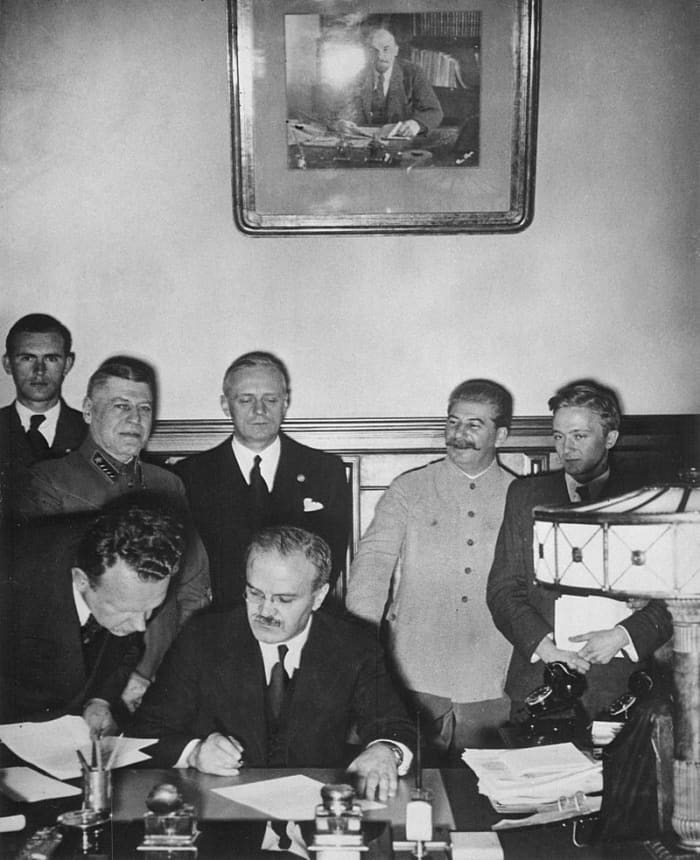 Russian Minister of Foreign Affairs Vyacheslav Molotov signs the Molotov–Ribbentrop Pact, a German–Soviet non-aggression pact August 23,1939.