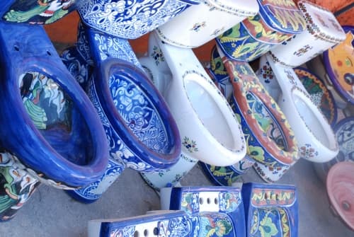 No! Practical, beautiful, crafted by local artisans in a style consistent with and representative of the culture, these hand painted Mexican toilets are folk art!