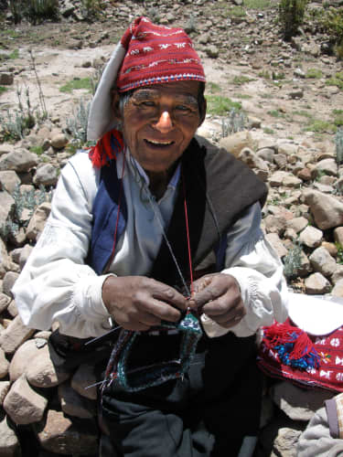 Probably not! Folk artists usually learn their craft from a relative or a skilled crafts person within their community. This Peruvian folk artist creates practical, beautiful, wearable works of art (like the one on his head!)