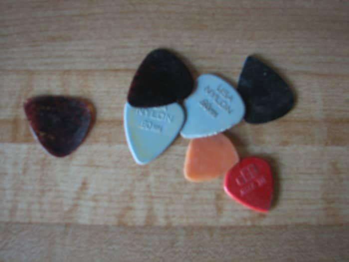 This group of picks were in one of the jars that lives on my computer desk. No reason to save them but maybe they are holding old songs they have plucked!