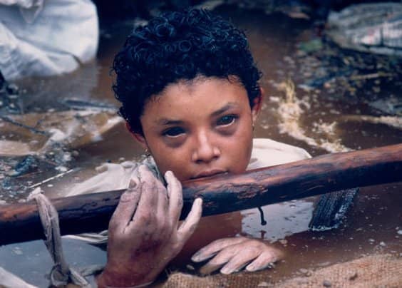 This is the only known picture of a child with entirely black eyes - and this child did not survive a natural disaster whereby her leg was trapped and she was stuck in toxic water... this is what made her eyes black - & also killed her.