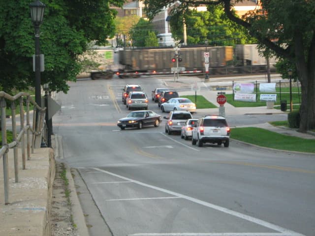 Traffic backing up as a train passes through downtown Hinsdale - a drawback from having available commuter traffic running through the center of the village