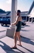 A funny thru-hiker called Straightjacket, "wearing" a foam sleeping pad while he washes his clothes at a laundromat