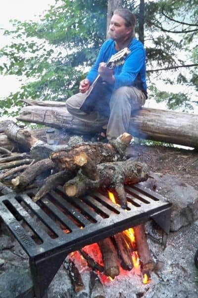 Steve plays us a tune around the campfire. You can collect wood as long as it's away from shore, dead and no longer standing.
