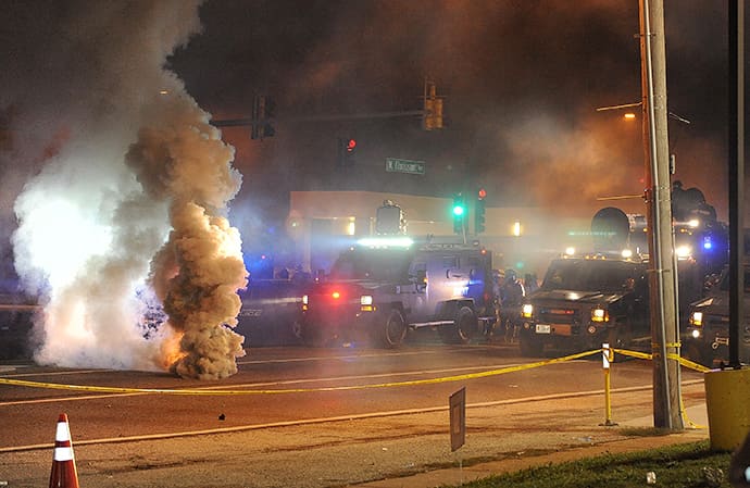 Law enforcement fires tear gas on protesters on West Florissant Road in Ferguson, Missouri on August 17, 2014. (AFP Photo / Michael B. Thomas)