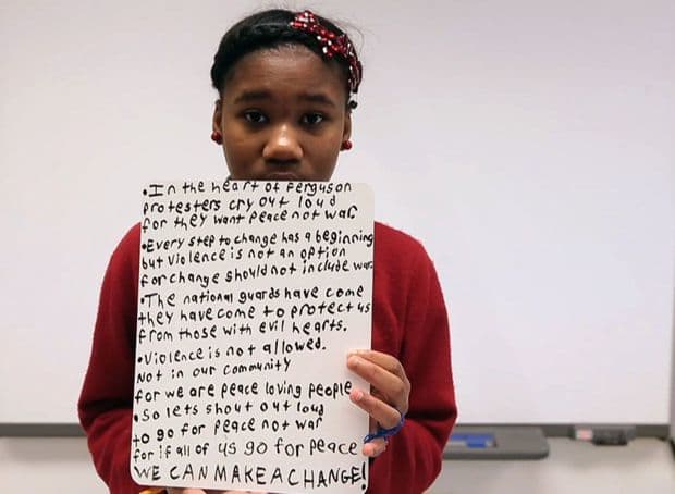 Seventh grader Tia Hudson shares her thoughts on images from the recent unrest in Ferguson on her first day back at school since the riot during Honors 7th grade English class on Tuesday, Dec. 2, 2014. Go to stltoday.com/video to listen to Hudson and