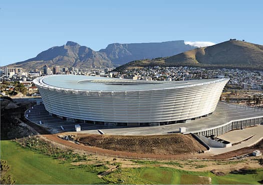 This subtle but attractive stadium is less a statement of its own than an exclamation point for a city with more than its share of iconic scenery. Positioned near the tip of Africa, Cape Town boasts an incredibly scenic oceanfront. And with Table Mou