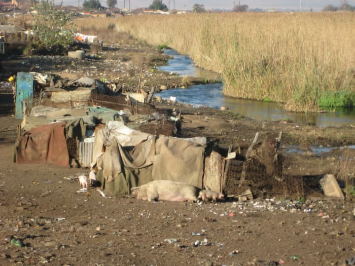 In Soweto, Kliptown Sqatter Camp, Southwest of Johannesburg, and this is one of the of the 45,000-person slums