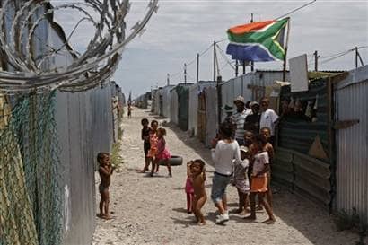 Children play in Blikkiesdorp, situated on the outskirts of Cape Town, south Africa. These people were targeted as the government tries to clean-up its image