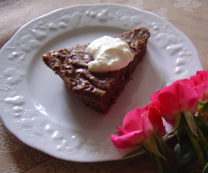 I love to make this rich, moist chocolate cake. This is served on a Limoges Porcelain plate, one of the regions most famous products.