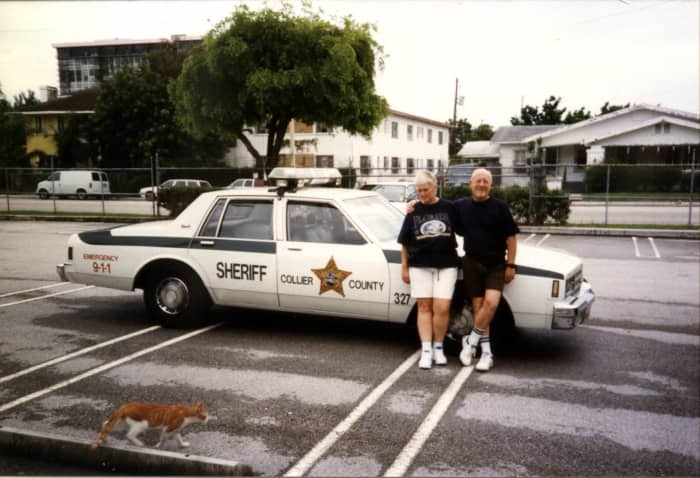 I think that this car was just an example of a typical police patrol car. I seem to be more interested in the cat that is passing by than posing for the photograph.