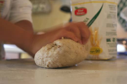 Kneading the dough stimulates the protein to enteract with the yeast; makes for a great rising homemade bread!