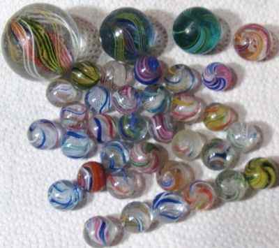 Beautiful handmades. Large 1.25 Solid Core, 33 awesome peewees minus the board and others. Recent purchase