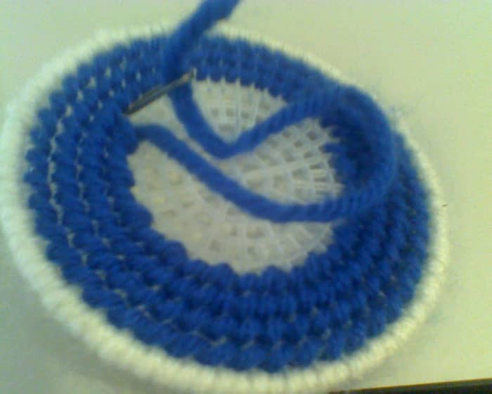 The basic pattern for stitching plastic canvas is up one hole and down another, usually at a diagonal.