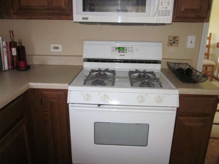 Stove remains centered under microwave even though it and the cabinet on the right of it needed to be moved slightly.