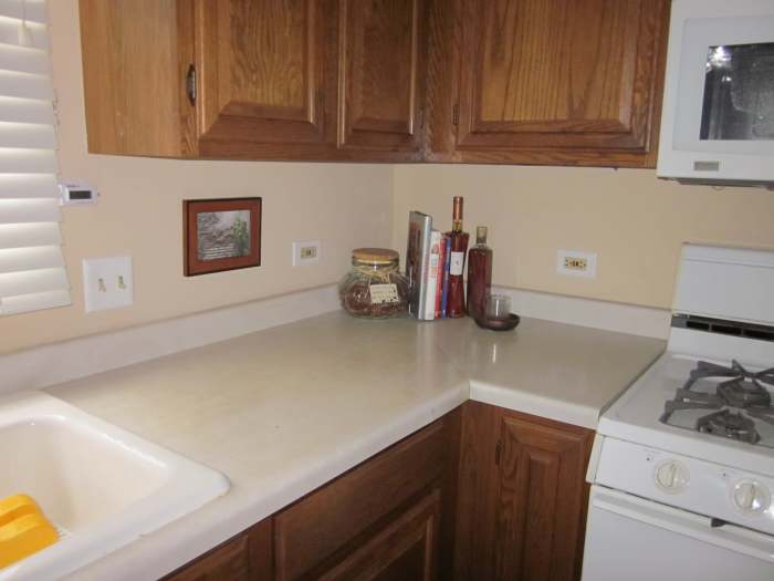 and has a tear just above the drawer to the right of the sink. That happened when I opened the drawer and a meat thermometer popped out. Before I could stop myself the tip got caught under the lip of the counter edge and make a tear. Ugh!