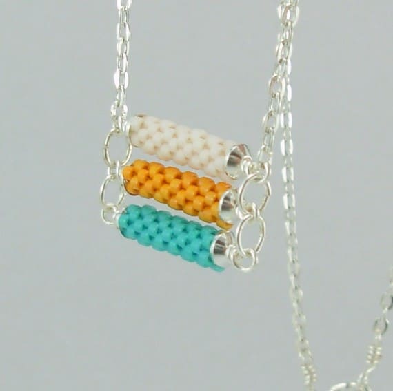 3 tier Beadwoven necklace in turquoise, orange and white: Combine several beaded beads with wire work to create stunning pieces like this one.