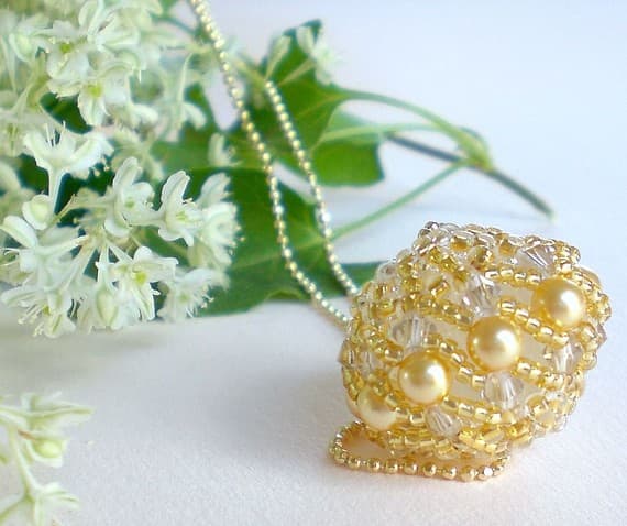 This elegant beaded bead makes a beautiful pendant. Matching beaded beads would make a perfect set for earrings or you could make a set of beads for a coordinating bracelet.
