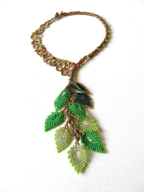 Leafing Out: Ginny also used beaded leaves to make a necklace. I love the mix of finishes and shades for the green leaves and the natural tree structure of the necklace.