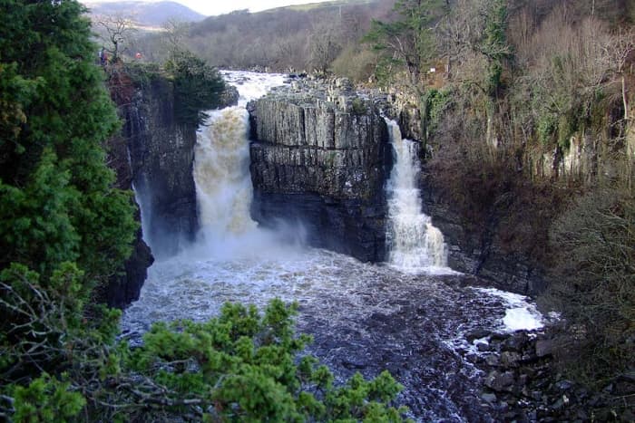 High Force waterfall's main drop (left) and its subsidiary (right). In autumn or wet Pennine weather both sides will see raging torrents that you feel under your feet nearly half a mile away on the footpath. This is the watershed area of the North