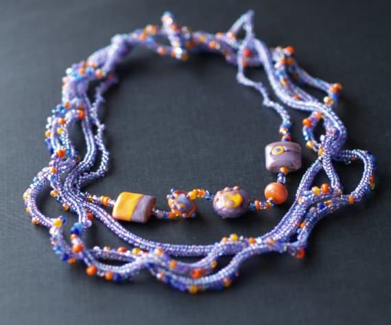 Over the Moon Necklace: MaryLou uses different sized seed beads as well as lamp work focals to create this stunning necklace.