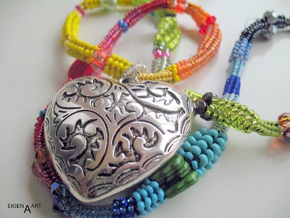 Colourful herringbone necklace with a silver heart: This necklaces contains different sized seed beads as well as a silver heart focal.
