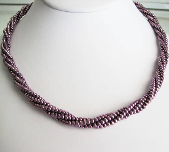 Beaded Rope Wrap in Eggplant: This piece can be wore as a necklace or wrapped as a bracelet.