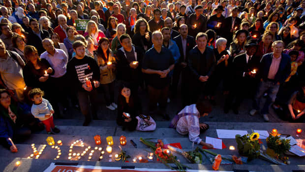 Hundreds of people gather for a candlelight vigil to remember late NDP leader Jack Layton in Vancouver, B.C., on Monday, August 22, 2011.