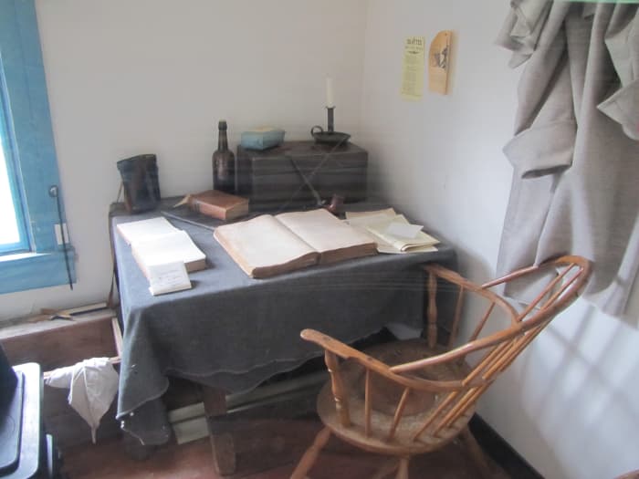 An officer might take up temporary quarters in a house with the troops in tents on the grounds. He could write up his reports at this temporary desk and then make an entry in his personal diary.