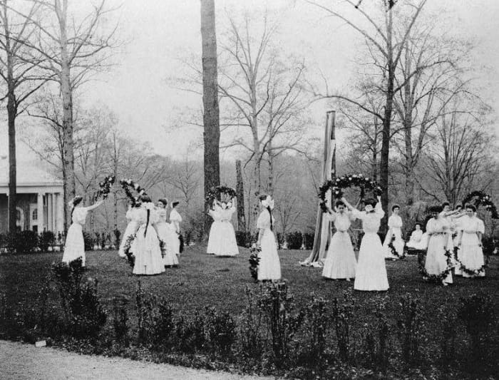 Here we have a photo dated back in the seventeenth century of people celebrating by holding a May festival including the traditional May Pole.