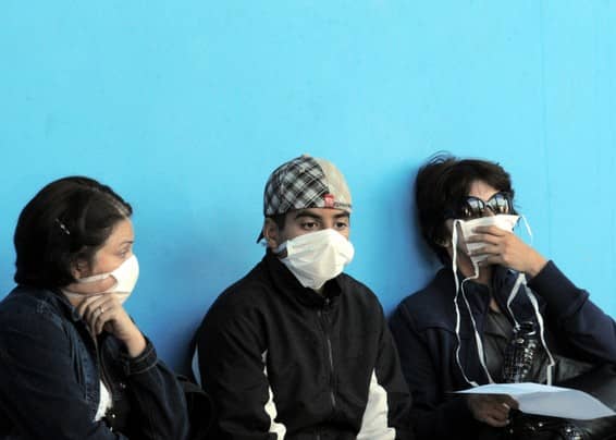 Just like a century ago - Brazilians protect themselves with facemasks during a 2009 outbreak of the avian flu.