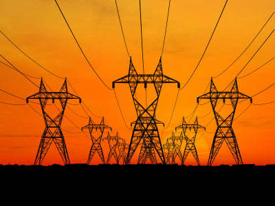 High voltage electrical lines such as these transmit alternating current from generating stations to consumers nationwide.