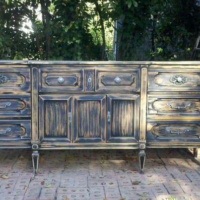 This Buffet was a circa 1970 piece. It had a blond finish. We sprayed it black then sanded it heavily to remove some 75% of the finish. The purchaser loved it. Our total investment in this piece was less tha $100