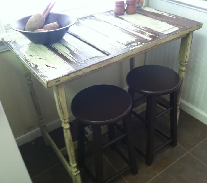 We built this bistro table from a section of old door. It was already distressed so we finished the legs and cross braces to match then added a coat of sealer to preserve to look.. Our total cost around $80