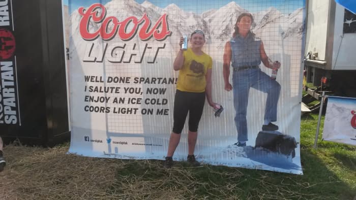 Savoring that beer at the finish despite being covered in mud. Mud runs are about personal achievement